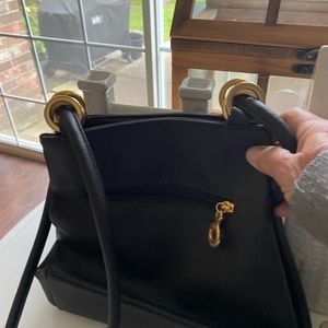 Brown leather purse with gold hardware